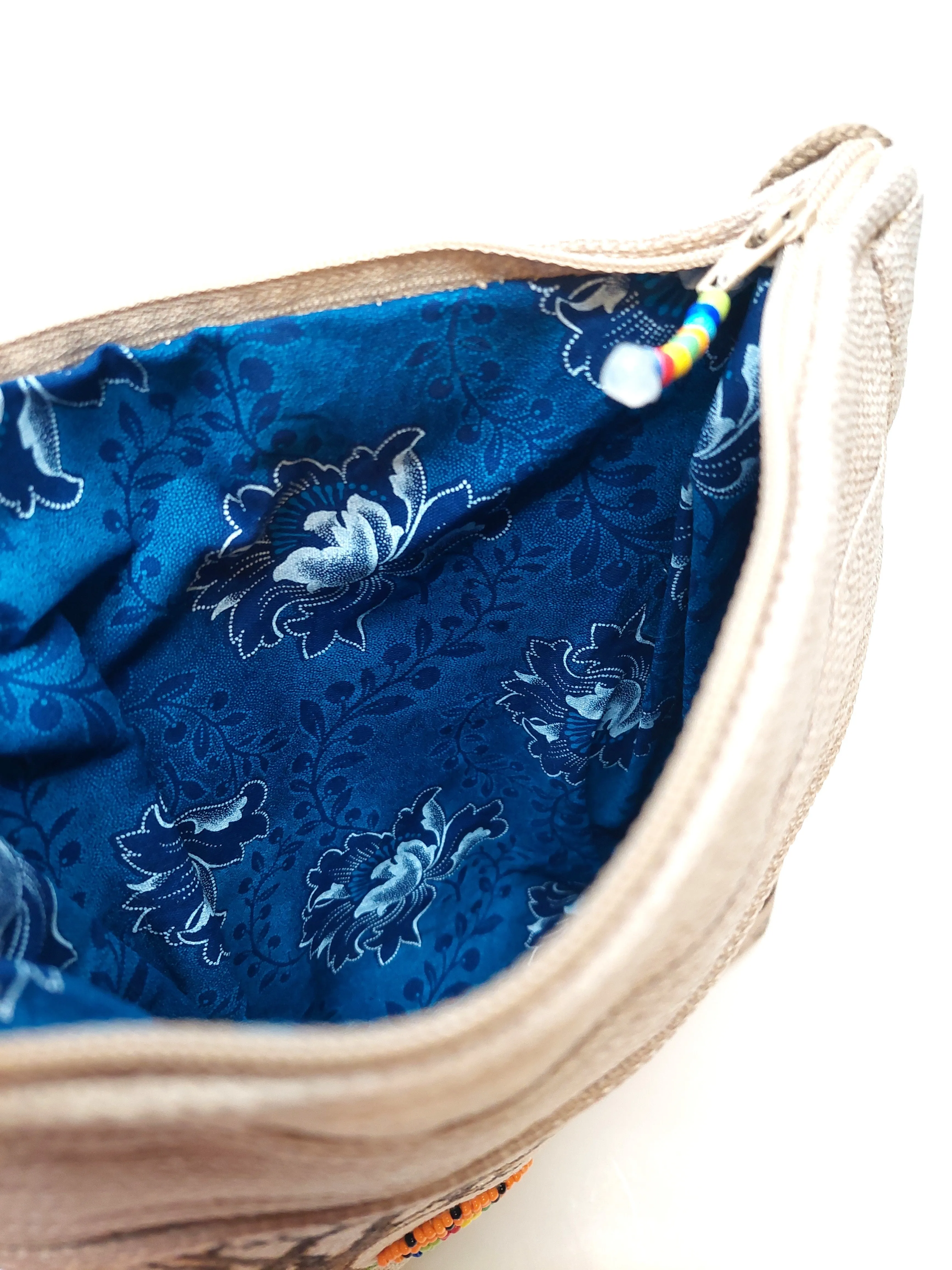 large beaded, hand painted sling bag lined with shweshwe